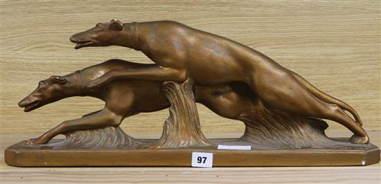 A plaster figure of Greyhounds, signed width 59cm height 23cm